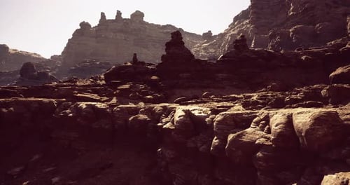 Stunning Rock Formations in a Vast Desert Landscape Under Bright Sunlight