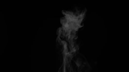 Rising White Smoke Against Black Background
