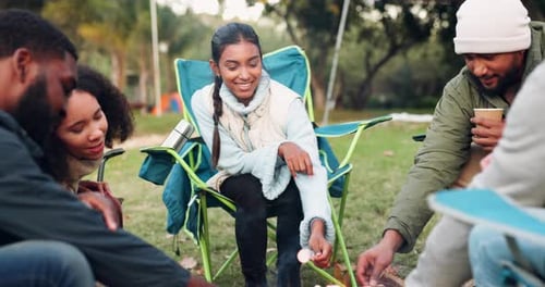 Camping, bonfire and friends with marshmallow in a forest for a celebration