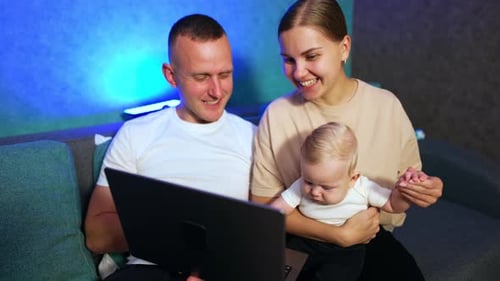 Happy smiling Caucasian people look at laptop.