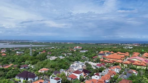 Expanse of Dense Greenery with Traditional Balinese Houses