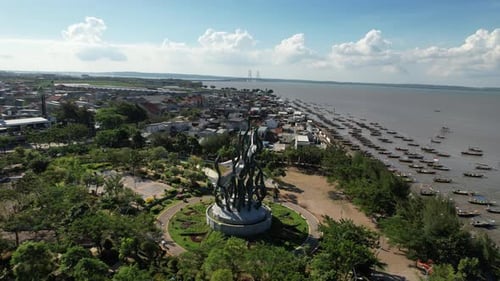 Vue aérienne de la statue d'un requin géant et d'un crocodile symbolisant la ville de Surabaya