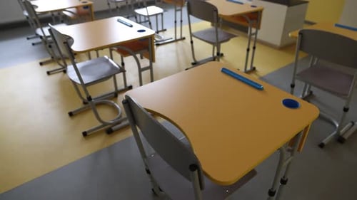 Stylish classroom with desks and chairs at school, closeup