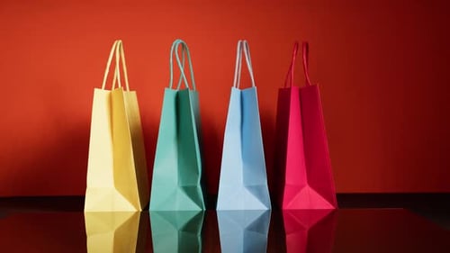 Colorful Shopping Bags Against Orange Background