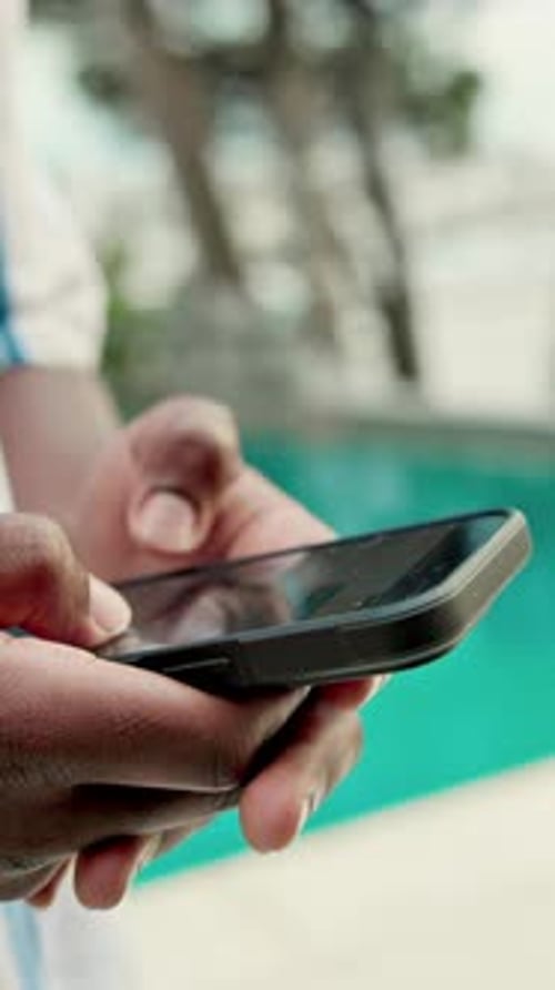 Hands, phone and holiday with pool for travel, weekend and scroll break
