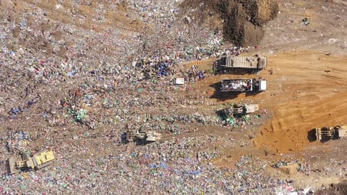Aerial View of Vast Landfill with Heavy Machinery