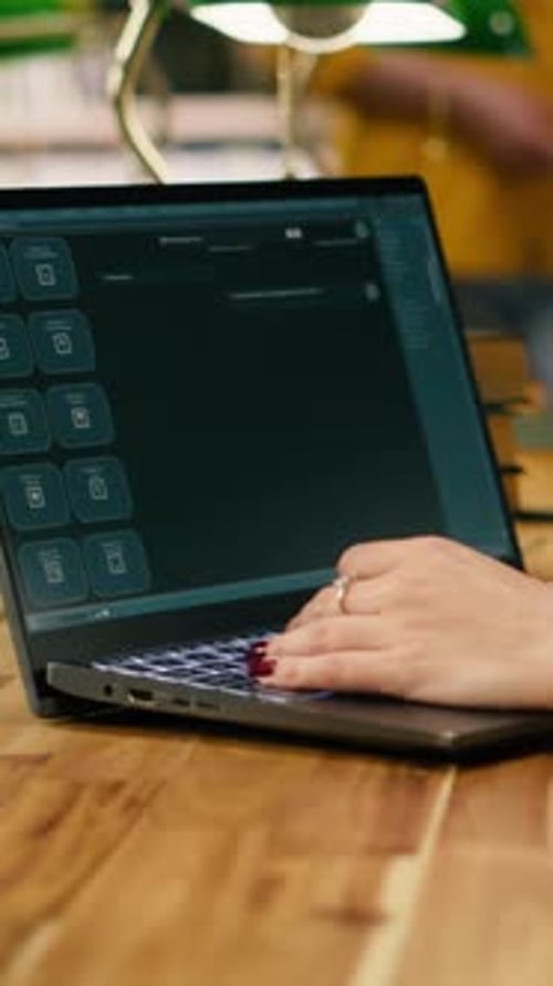 Vertical Video Student Uses Laptop with AI Chatbot Interface at Library Table