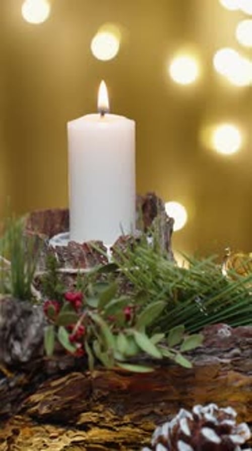 Vertical video. Christmas home decoration. Candles with ornaments on a wooden bark-shaped stand. Sli