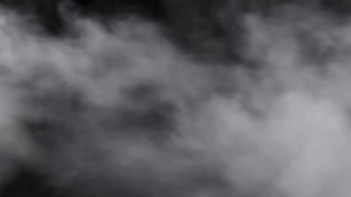 White Smoke Swirls on Black Background