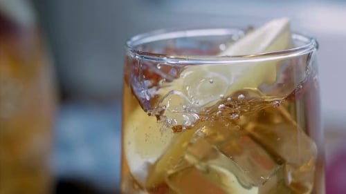 Refreshing Iced Tea with Lemon Slice in Glass