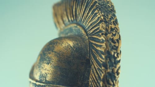 A rotating close up macro shot of a spartan warrior metal bronze ancient greek helmet, studio lighti