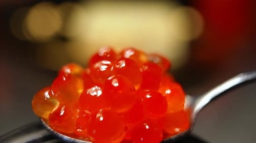 Closeup Spoon with Delicious Red Caviar Indoors