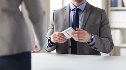 People, Business, Corruption, Bribery and Fraud Concept - Close Up of Businessman