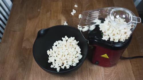 Popcorn Machine Fills Bowl with Delicious Snack