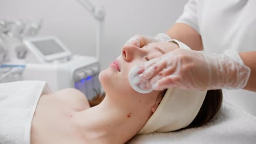 face skin facial rejuvenation cosmetic procedure Woman patient in cosmetology clinic doctor