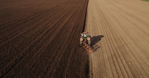 Aerial View of Tractor Plowing the Field