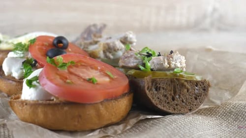 Assortment of Colorful Homemade Sandwiches Rotating on Table