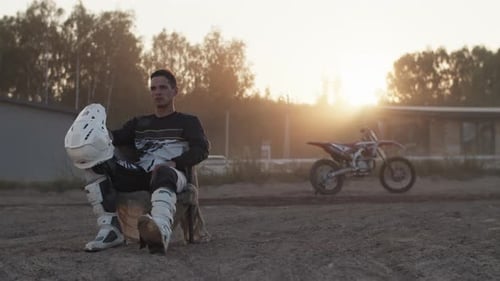 Rider Taking a Break After Dirt Bike Ride