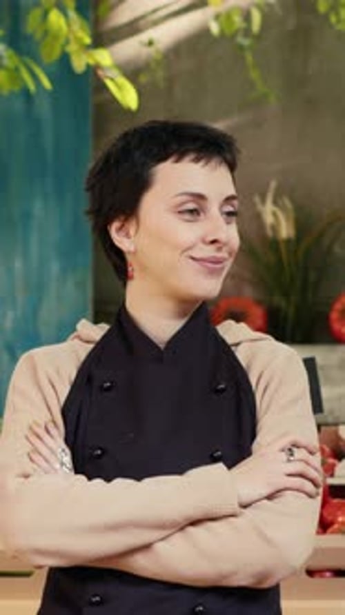 Vertical Video Caucasian Vendor Standing with Amrs Crossed at Farmers Market Stand