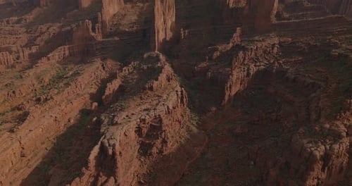 Aerial View of Moab's Iconic Fisher Towers at Sunrise in Utah