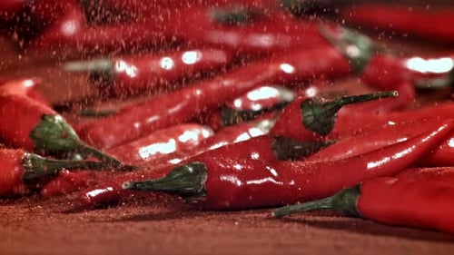 Ground Red Pepper Falls on the Table Filmed on a Highspeed Camera at 1000 Fps
