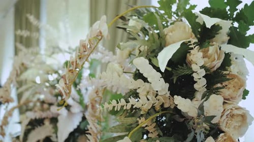 Elegant White and Cream Floral Wedding Arrangement
