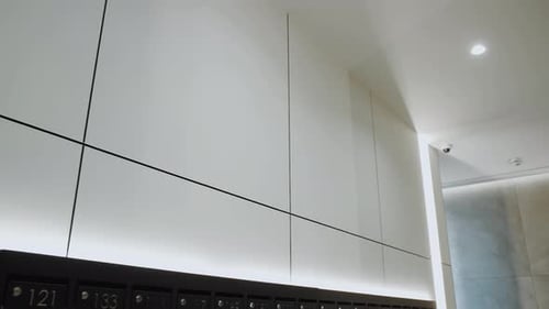 Modern White Apartment Mailboxes in a Sleek Hallway