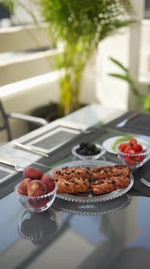 Elegant Outdoor Breakfast with Fruits and Pastries Ideal for a Leisurely Morning Meal