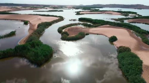 Aerial View of Desert Landscape with Scattered Lakes