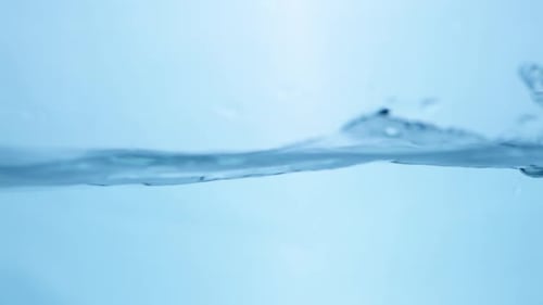Abstract Water Surface Ripple. Natural Fluid Patterns in a Clear Blue Environment.