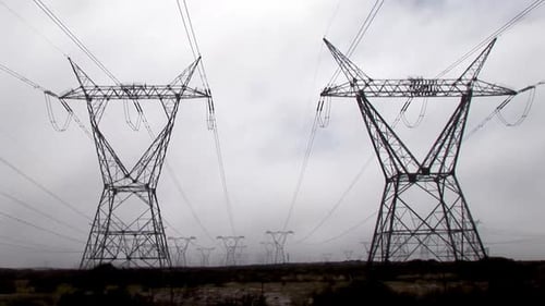 Field of Electricity Pylons on Overcast Day