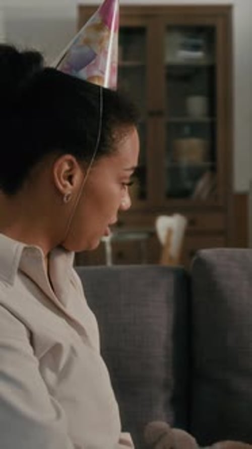 Curly Haired Toddler Gets Party Hat and Gift