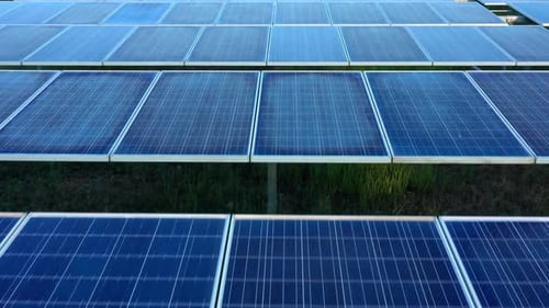 Aerial view of solar panels stand in a row landscape electrical power