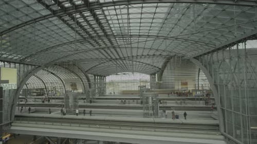 Travelers at modern train station platform time lapse, trains arrive and depart