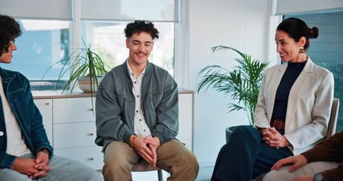 Man, talk and support group with therapy in workplace for mental health, listen and smile at office