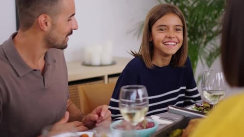 Happy Family Enjoying Mealtime Together Indoors
