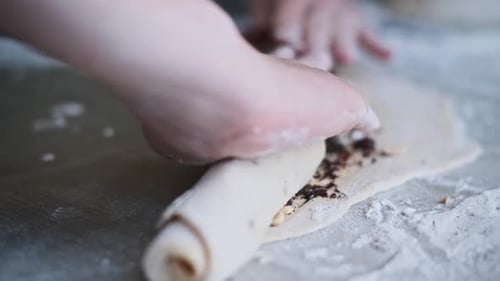 Making Sweet Roll with Chocolate and Berry Filling