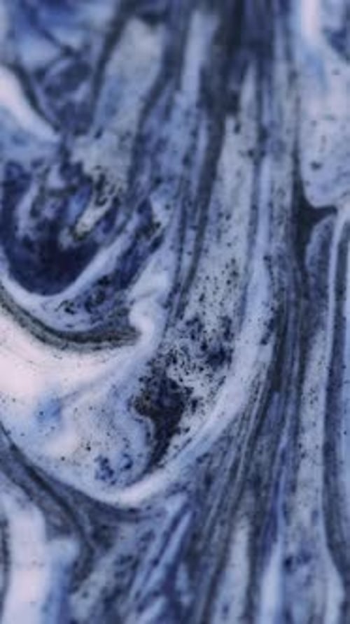 Abstract Swirling Blue, White, and Black Fluids