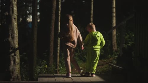 Kids on Glamping House Ground Among Wild Summer Forest