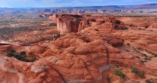 Aerial View of Rocky Desert Landscape with Blue Sky