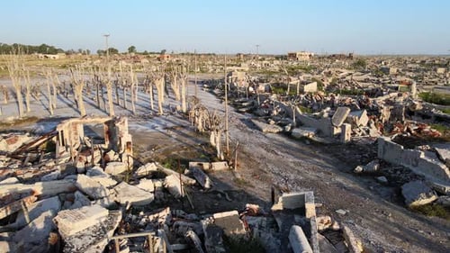 Desolate silence landscape, ruins of abandoned epecuen village, aerial drone tracking shot capturing