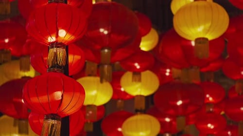 Red and Yellow Chinese Lanterns Glowing in the Night