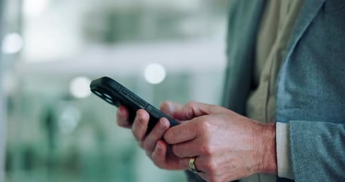 Business, hands and typing with smartphone in office for text message, checking notifications