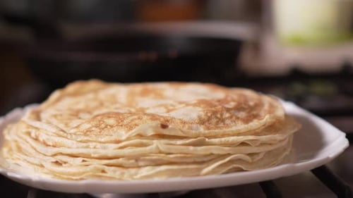 Stack of Pancakes Served on Plate Indoors