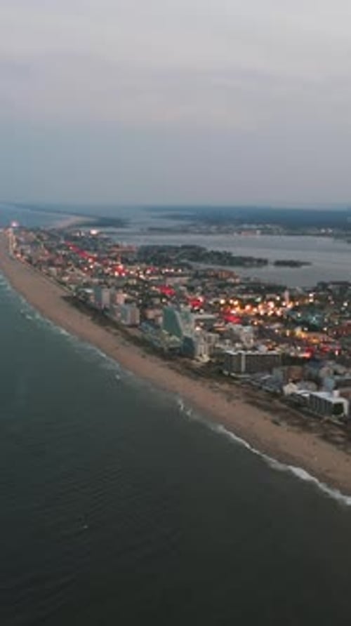 Vertical View Of Ocean City Resort Town At Dusk In The State Of Maryland, United States. Aerial Shot