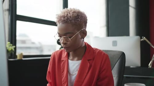 Focused and Driven Young Professional Excelling in a Modern Office Work Environment