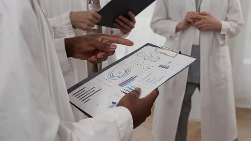 Medical Professionals Reviewing Patient Data and Charts
