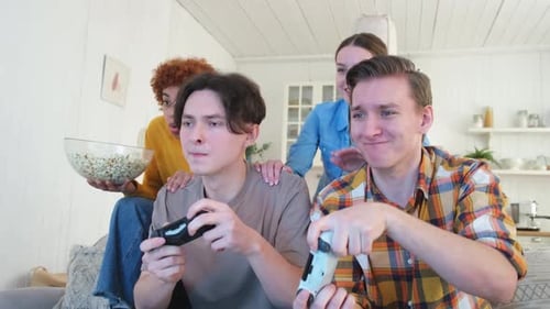 Home Party Cheerful Group of Friends Playing Video Games at Home Happy Diverse Group Buddies Having