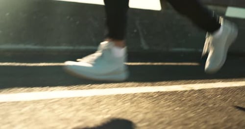 Fitness, legs and person running for workout, cardio and health on road with exercise and training