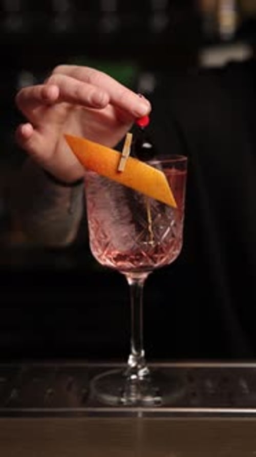 the bartender prepares a cocktail at the bar